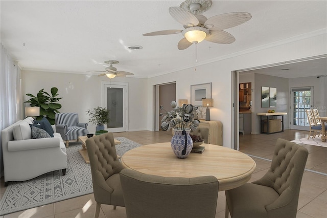 tiled dining room with crown molding