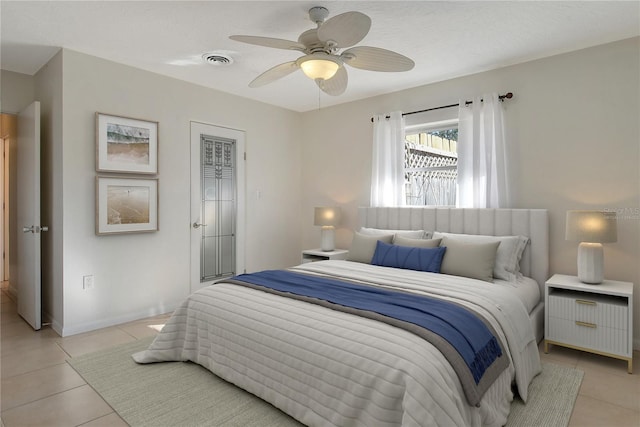 tiled bedroom with ceiling fan