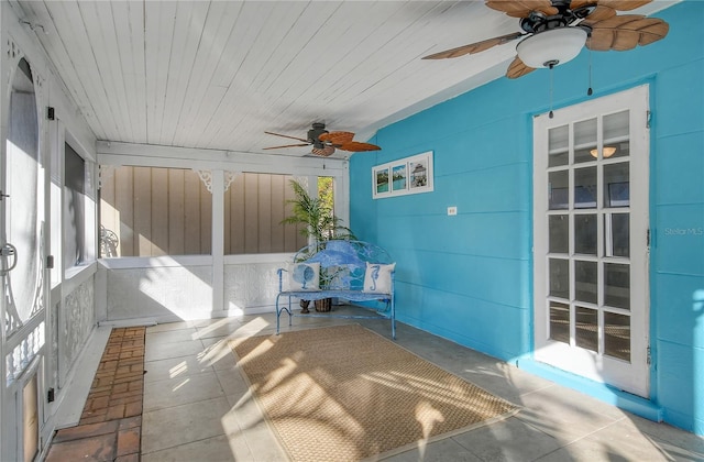 unfurnished sunroom featuring wood ceiling