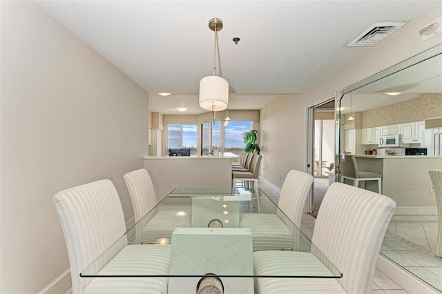 dining area with a textured ceiling