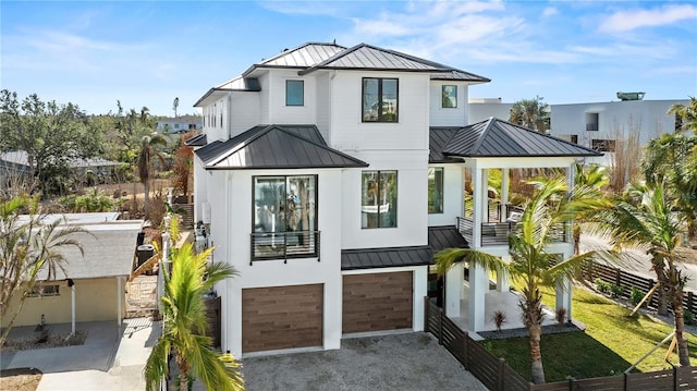 rear view of property featuring a garage and a yard