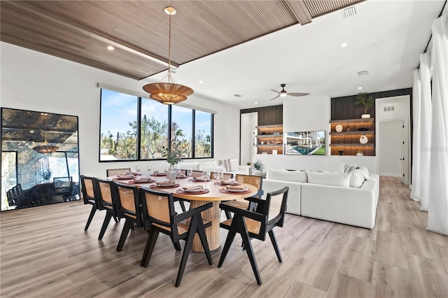 dining space featuring light hardwood / wood-style flooring, ceiling fan, and wood ceiling