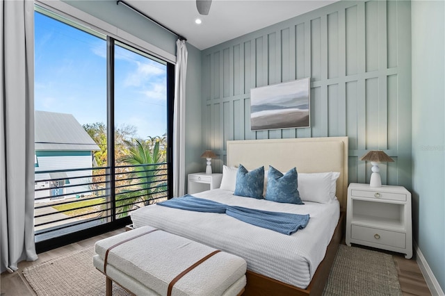 bedroom featuring hardwood / wood-style flooring and ceiling fan