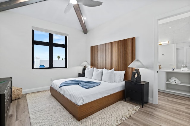 bedroom with beamed ceiling and ceiling fan