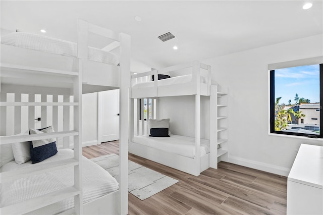 bedroom with light hardwood / wood-style flooring