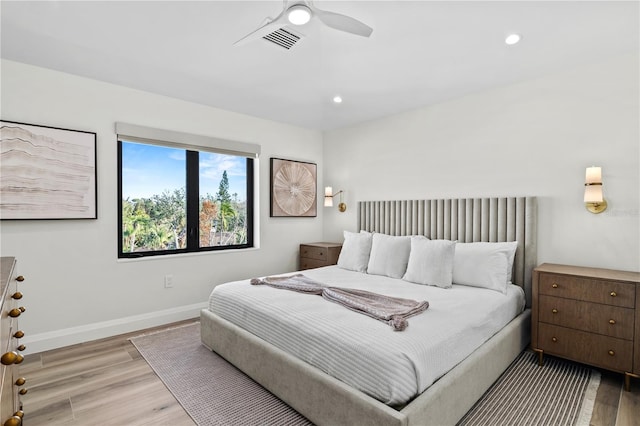 bedroom featuring ceiling fan and light hardwood / wood-style flooring