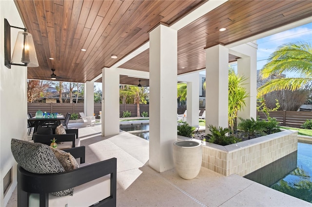 view of patio / terrace featuring ceiling fan