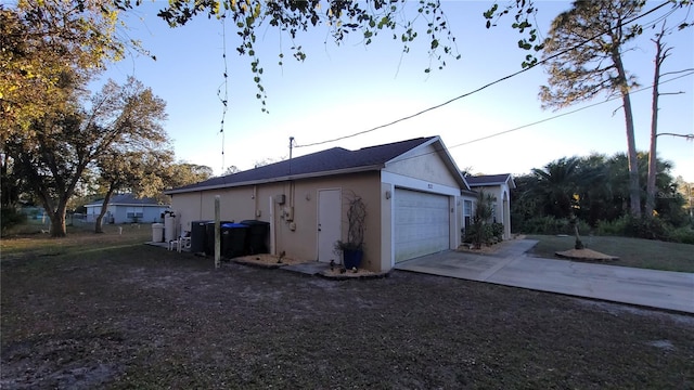 view of side of property featuring a garage