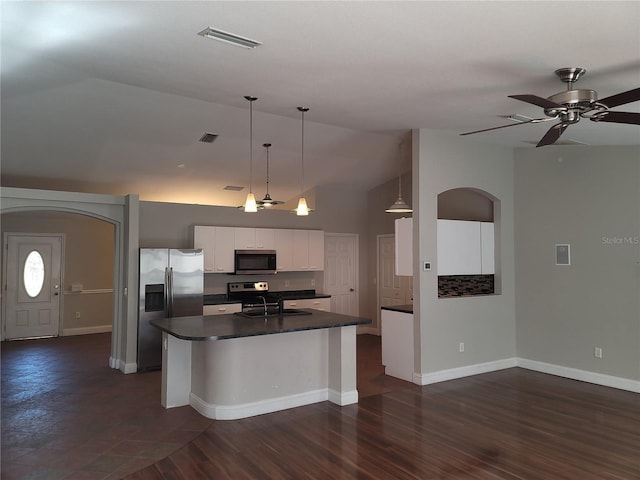 kitchen featuring a center island with sink, hanging light fixtures, ceiling fan, appliances with stainless steel finishes, and white cabinetry