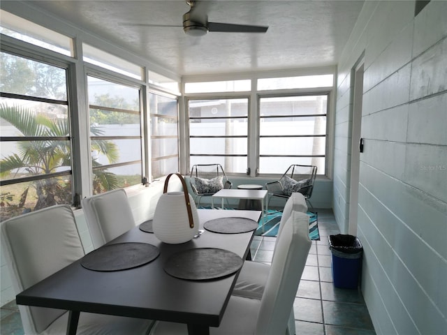 sunroom with plenty of natural light and ceiling fan