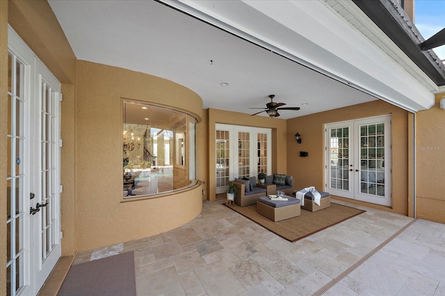 view of patio / terrace with ceiling fan, an outdoor living space, and french doors