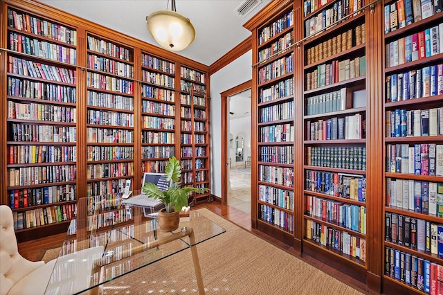 living area featuring ornamental molding