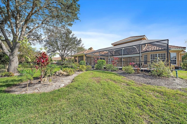 view of yard with glass enclosure