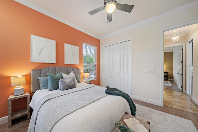 bedroom featuring a closet, ceiling fan, and crown molding