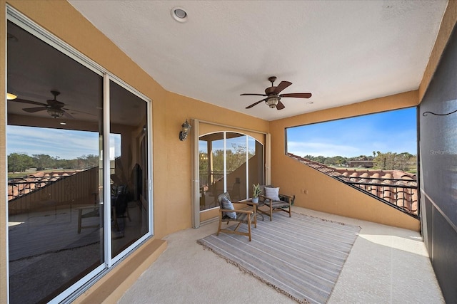 sunroom / solarium with ceiling fan