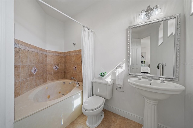 bathroom with tile patterned flooring and toilet