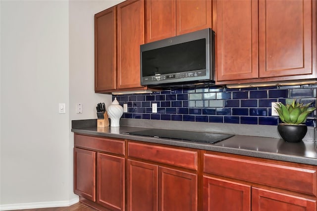 kitchen with decorative backsplash and black electric cooktop