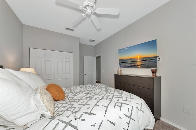 carpeted bedroom featuring ceiling fan and a closet