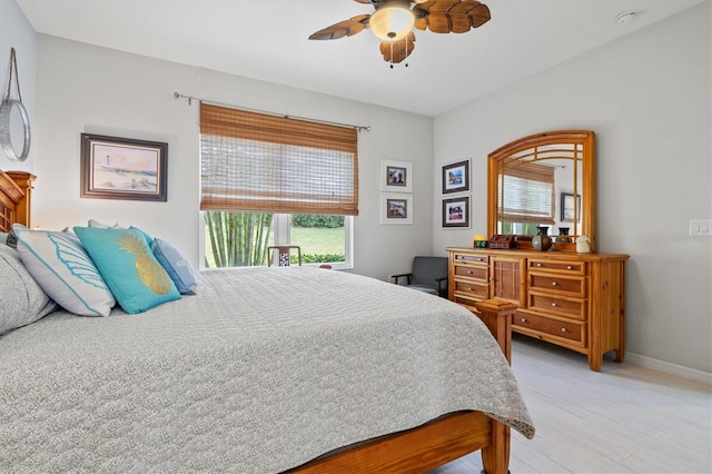 bedroom featuring ceiling fan and light wood-type flooring