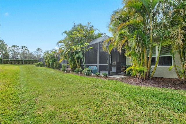 view of yard with a lanai