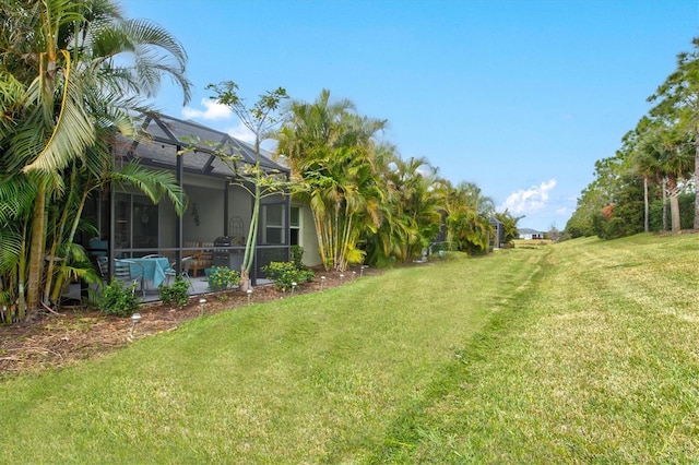 view of yard with a patio and a lanai