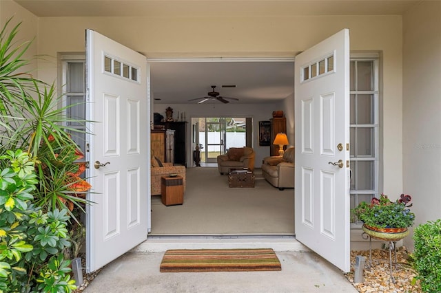 entrance to property featuring ceiling fan