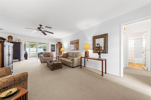 living room featuring light carpet and ceiling fan