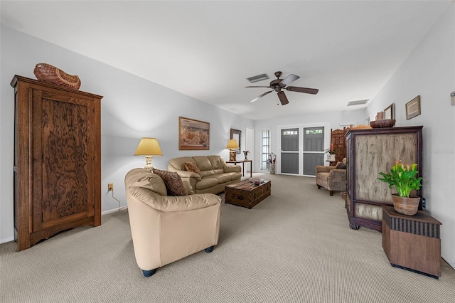 carpeted living room featuring ceiling fan