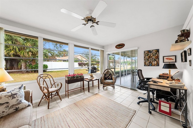 tiled home office with a wealth of natural light and ceiling fan