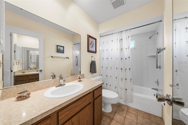 full bathroom featuring tile patterned floors, vanity, shower / tub combo, and toilet