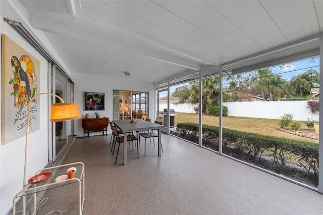 sunroom / solarium with beamed ceiling