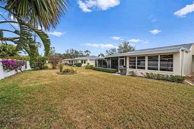 view of yard featuring a sunroom