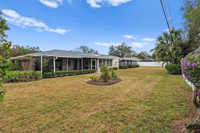 view of yard featuring a sunroom