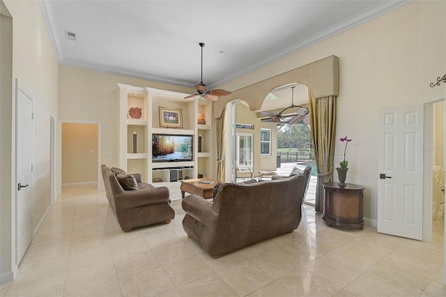 tiled living room featuring ceiling fan, built in features, and ornamental molding