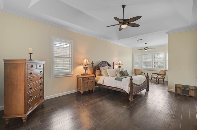 bedroom featuring ceiling fan, dark hardwood / wood-style floors, ornamental molding, and a raised ceiling