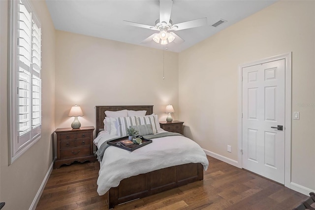 bedroom featuring ceiling fan and dark hardwood / wood-style floors