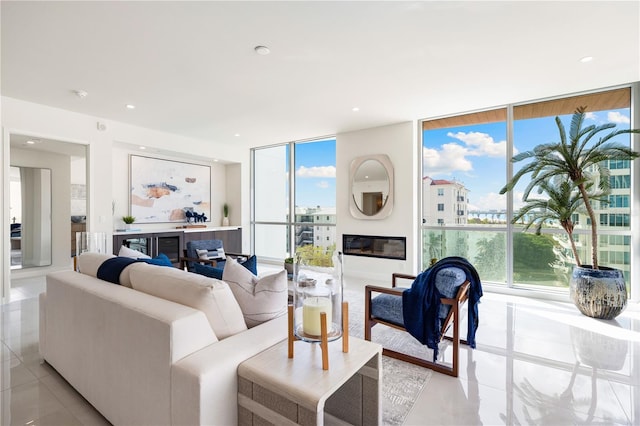 living room featuring floor to ceiling windows and light tile patterned floors