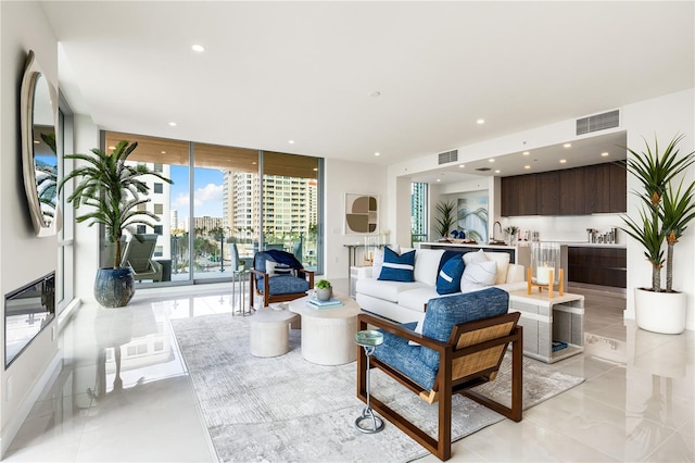 living room with floor to ceiling windows