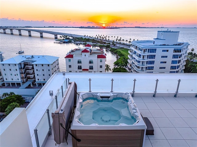 aerial view at dusk with a water view