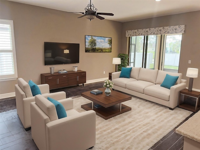 living room featuring ceiling fan, plenty of natural light, and light hardwood / wood-style flooring