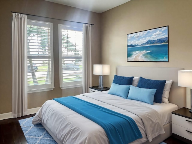 bedroom with dark hardwood / wood-style floors