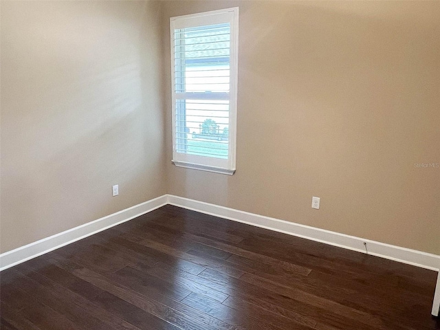 unfurnished room featuring dark hardwood / wood-style floors