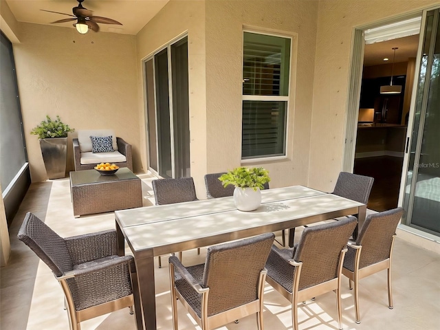 view of patio / terrace featuring ceiling fan and an outdoor living space