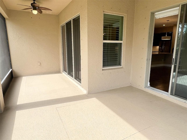 view of patio featuring ceiling fan