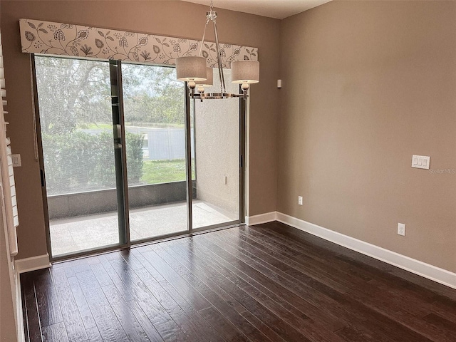 unfurnished dining area with dark hardwood / wood-style flooring