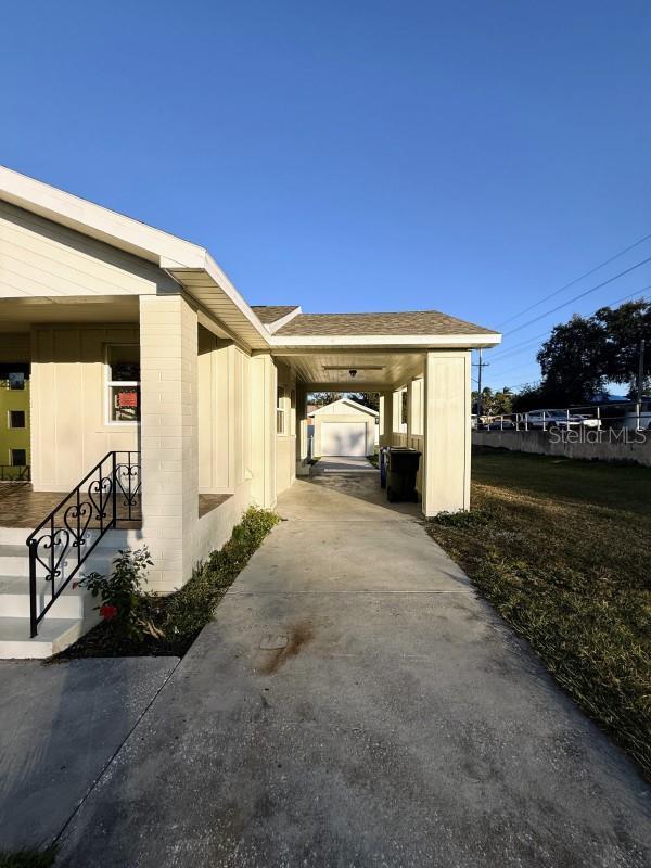 view of property exterior with a carport