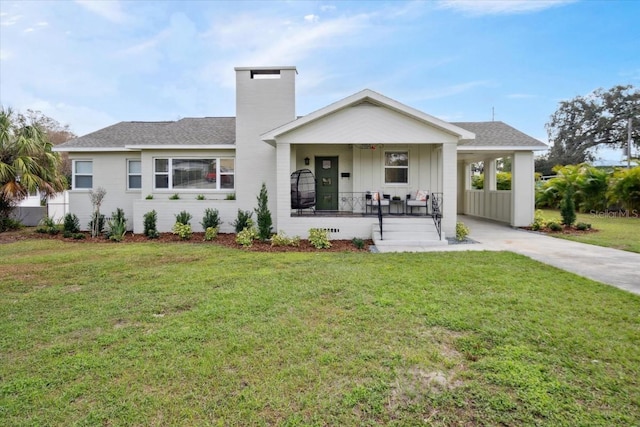 view of front of property with covered porch and a front yard