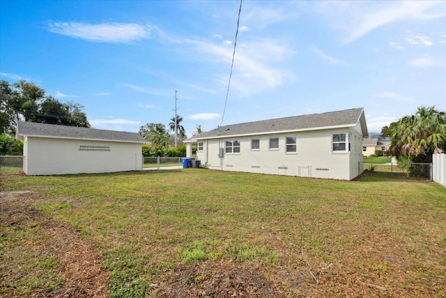 back of house with a yard