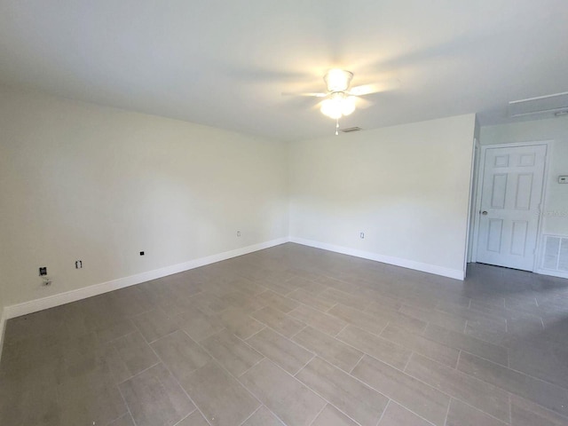 spare room with ceiling fan