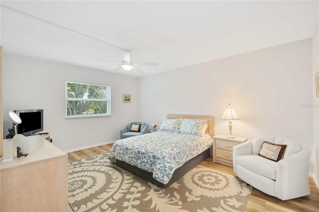 bedroom featuring ceiling fan and light hardwood / wood-style floors